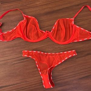 Lounge red mesh bra and panty set.
